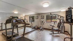 A gym with treadmills, elliptical machines, and weight equipment. - Quality Inn Atlanta Airport - Central (College Park)