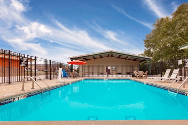 Outdoor pool, open 9:00 AM to 10:00 PM, pool umbrellas, pool loungers