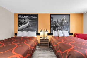 A hotel room with two beds, a nightstand with a lamp, and two large cityscape posters on the wall. - Super 8 by Wyndham Siloam Springs (Siloam Springs)