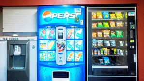 A vending machine with a Pepsi logo, surrounded by other vending machines. - Red Roof Inn PLUS+ Birmingham East - Irondale/ Airport (Birmingham)