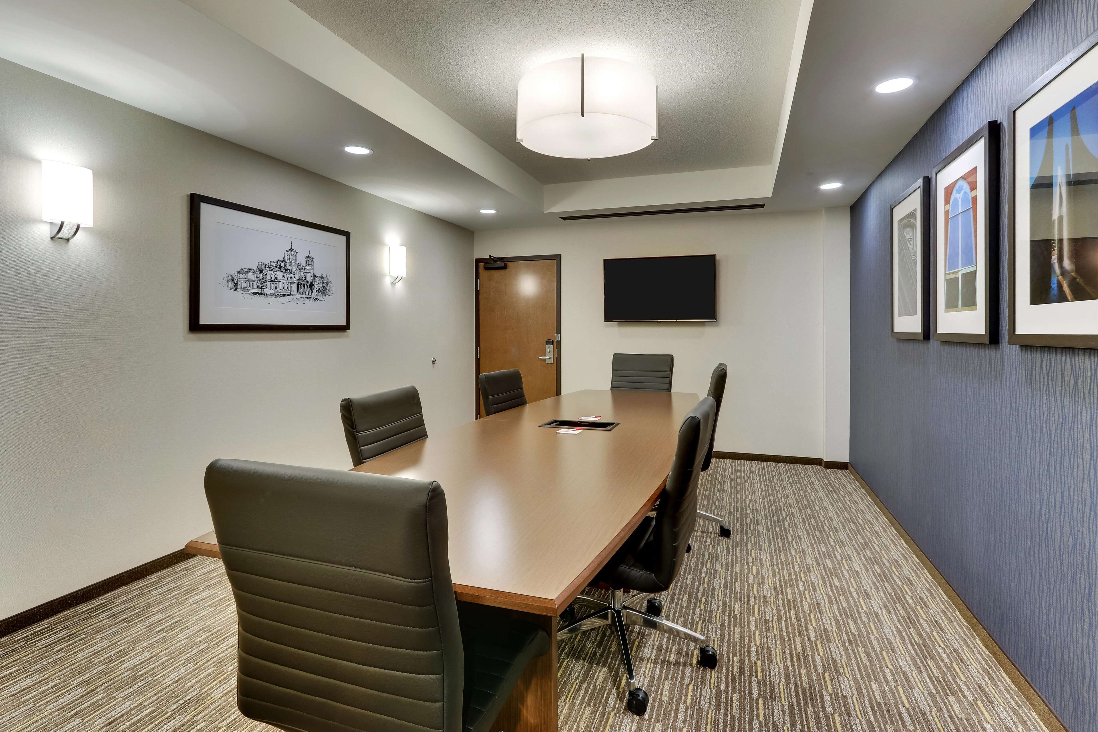 suite, 1 king bed, accessible, refrigerator & microwave (2 rooms, board room table, roll in) | desk, blackout curtains, iron/ironing board, free cots/infant beds