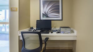 A business center desk with a computer, printer, and chair. - Candlewood Suites Pensacola - University Area by IHG (Pensacola)