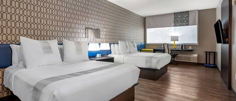 Premium bedding, memory-foam beds, laptop workspace, blackout curtains