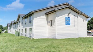 A two-story building with a sign indicating it is a Coldwater Inn & Suites. - Coldwater Inn & Suites near I 69 (Coldwater)