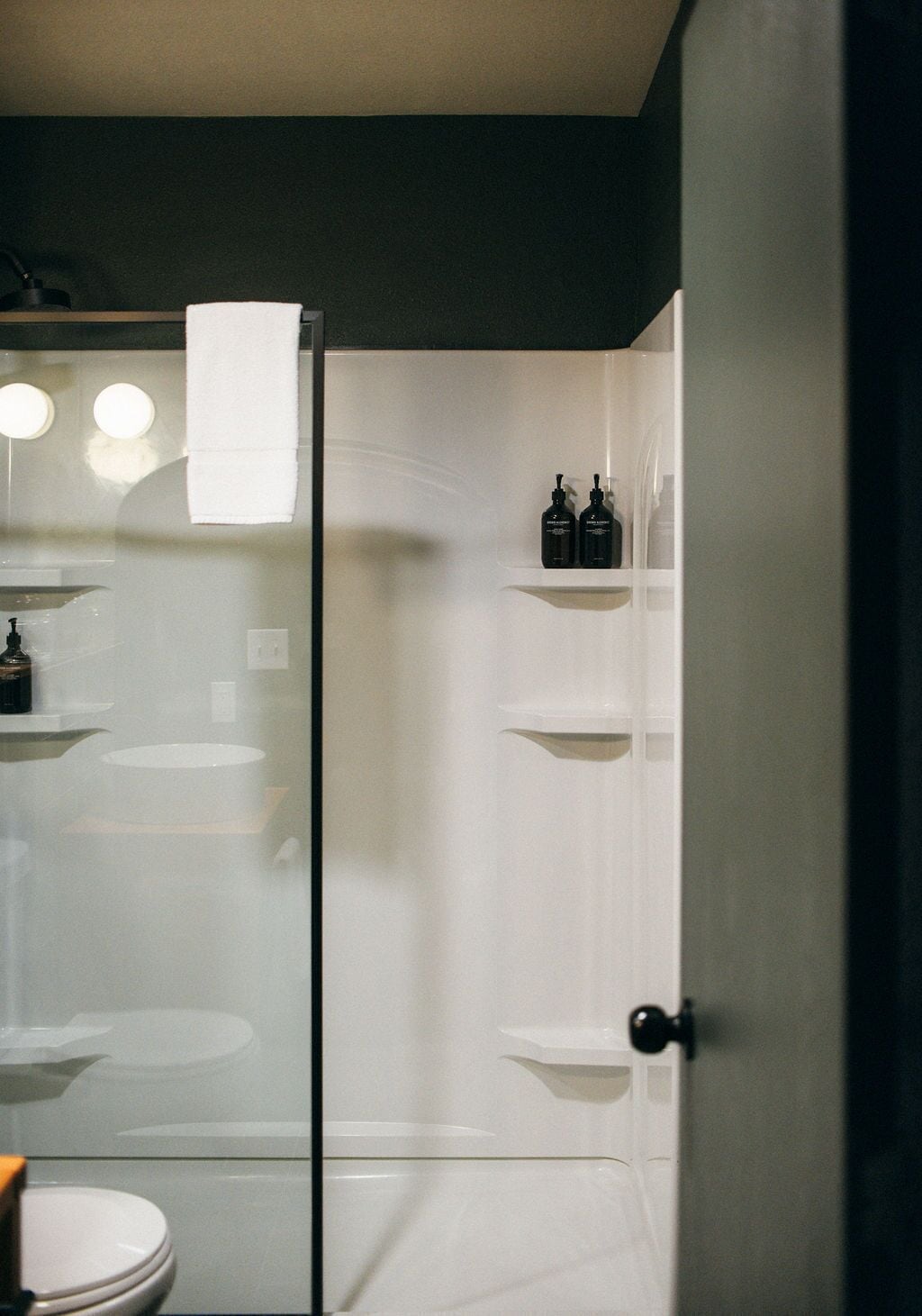 shower, designer toiletries, hair dryer, towels