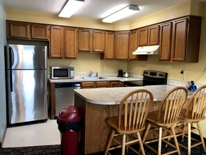 Suite, 1 King Bed, Non Smoking (One-Bedroom) | Private kitchen | Fridge, microwave, coffee/tea maker