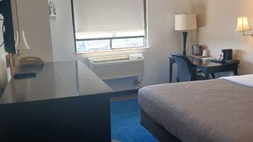 Room, 1 King Bed, Non Smoking | Desk, laptop workspace, iron/ironing board, WiFi
