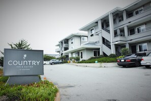 A multi-story building with a sign for 'Country Inn & Suites by Radisson'. - Country Inn & Suites by Radisson, Monterey Beachfront-Marina, CA (Marina)
