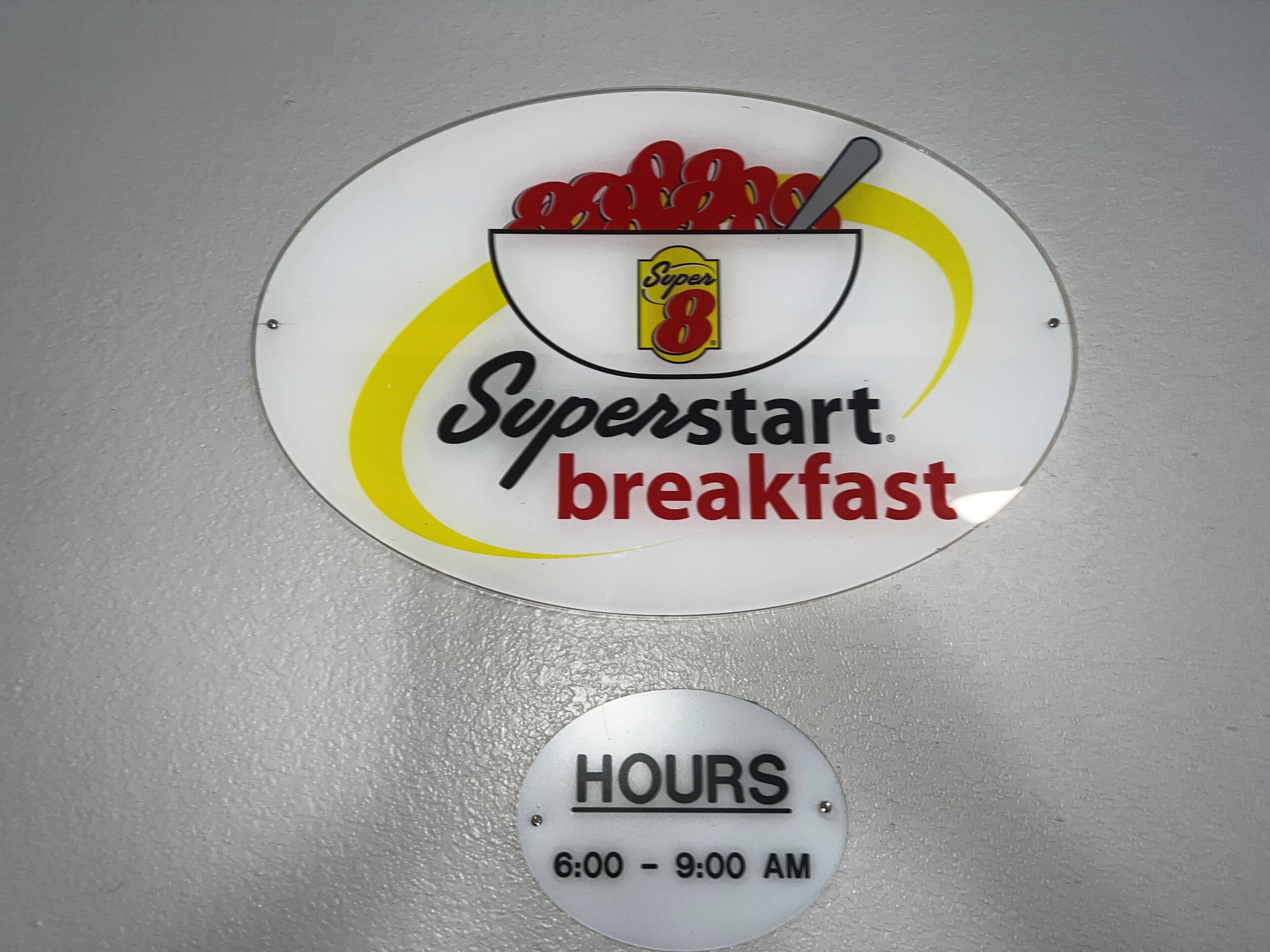 A sign for Superstart breakfast with operating hours from 6:00 to 9:00 AM.