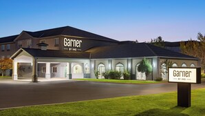 A hotel named 'Garner' with a modern architectural design, featuring a covered entrance and multiple windows. - Garner Hotel Salt Lake City Airport by IHG (Salt Lake City)