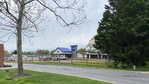 A building with a blue roof and a sign that reads "Travelodge." - Travelodge by Wyndham Laurel/Ft. Meade/Near NSA (Laurel)