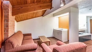 Suite, 1 King Bed, Non Smoking | Desk, laptop workspace, iron/ironing board, free WiFi