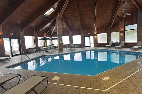 Indoor pool, open 9:00 AM to 9:00 PM, pool umbrellas, sun loungers