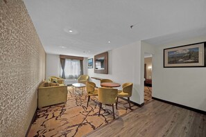 Suite, 1 King Bed, Non Smoking | Living area | 32-inch flat-screen TV with satellite channels, TV