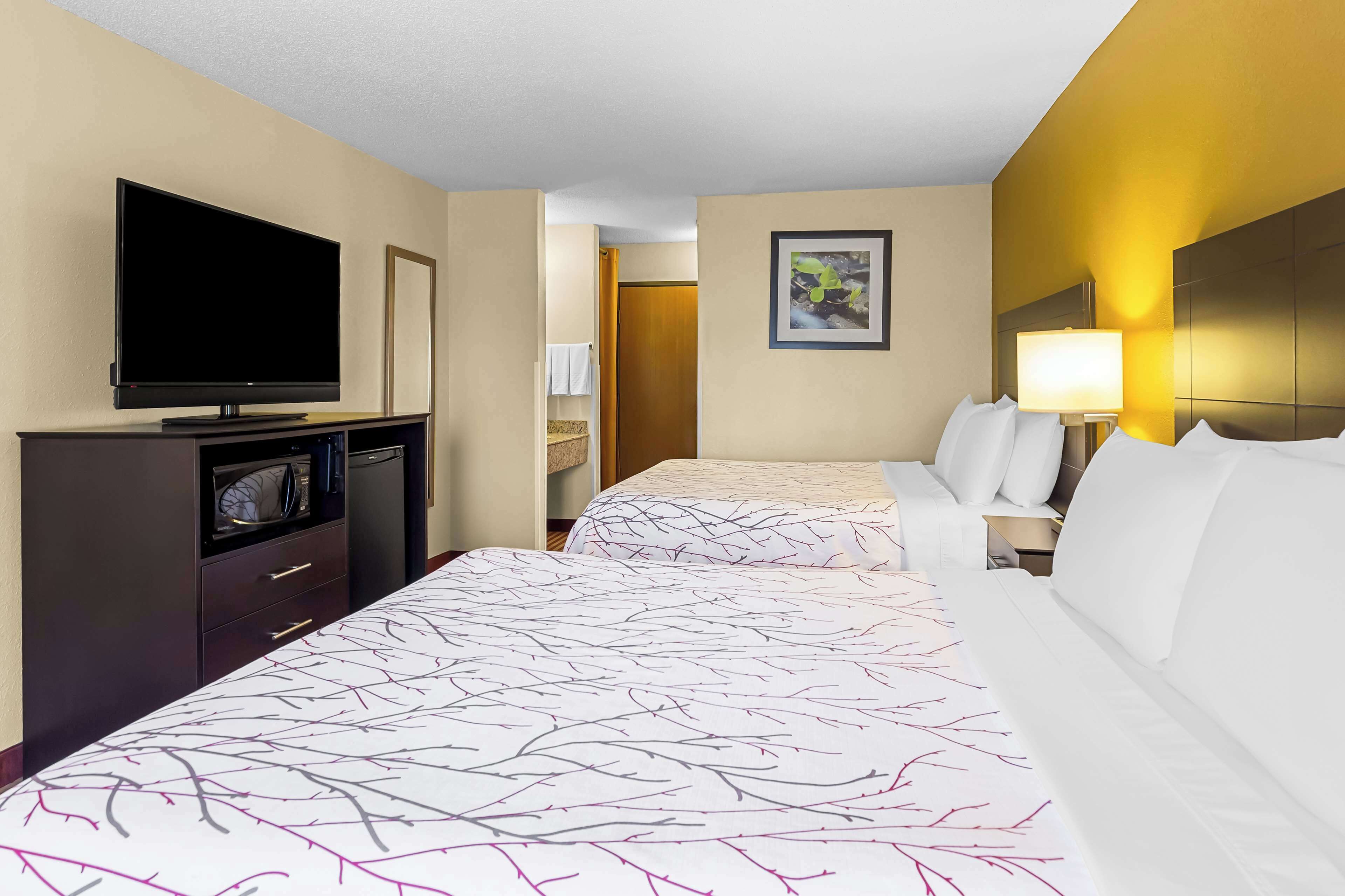 standard room, 2 queen beds, non smoking, refrigerator & microwave | soundproofing, iron/ironing board, free cots/infant beds, internet