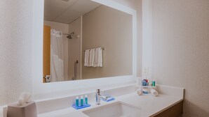 A modern bathroom with a large mirror, two sinks, and a shower. - Holiday Inn Express Branford-New Haven by IHG (Branford)
