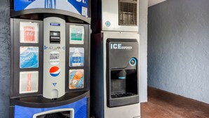 A vending machine with Pepsi and Coca-Cola options, a calorie counter, and an ice dispenser. - SureStay Hotel by Best Western Sarasota Lido Beach (Sarasota)