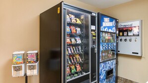 A vending machine area with snack and drink options, including a 'THIRST QUENCHERS!' machine. - Quality Inn Parkersburg North - Vienna (Parkersburg)