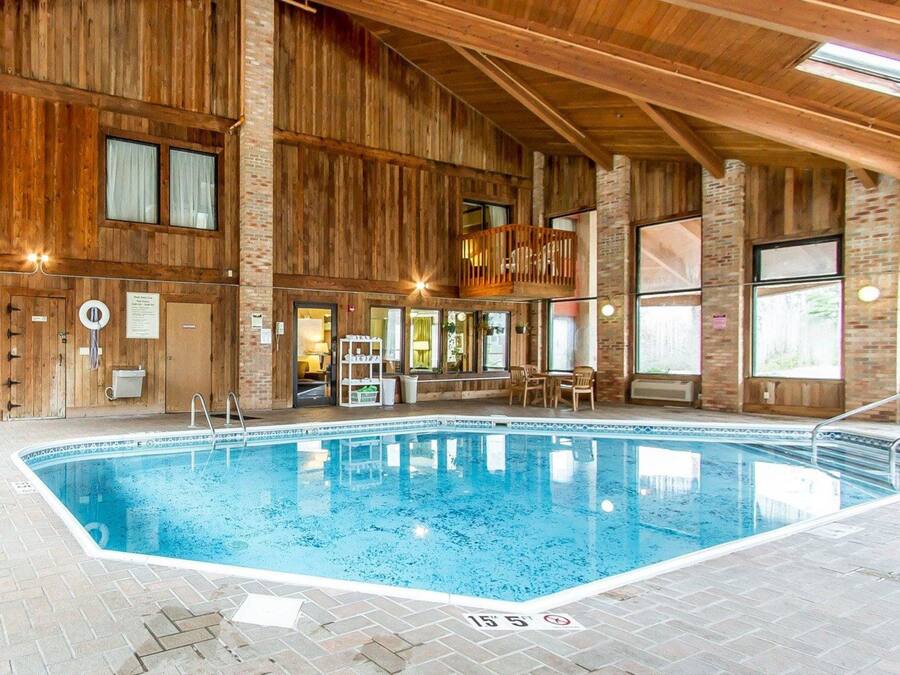 Indoor pool, open 8:00 AM to 10:00 PM, pool loungers