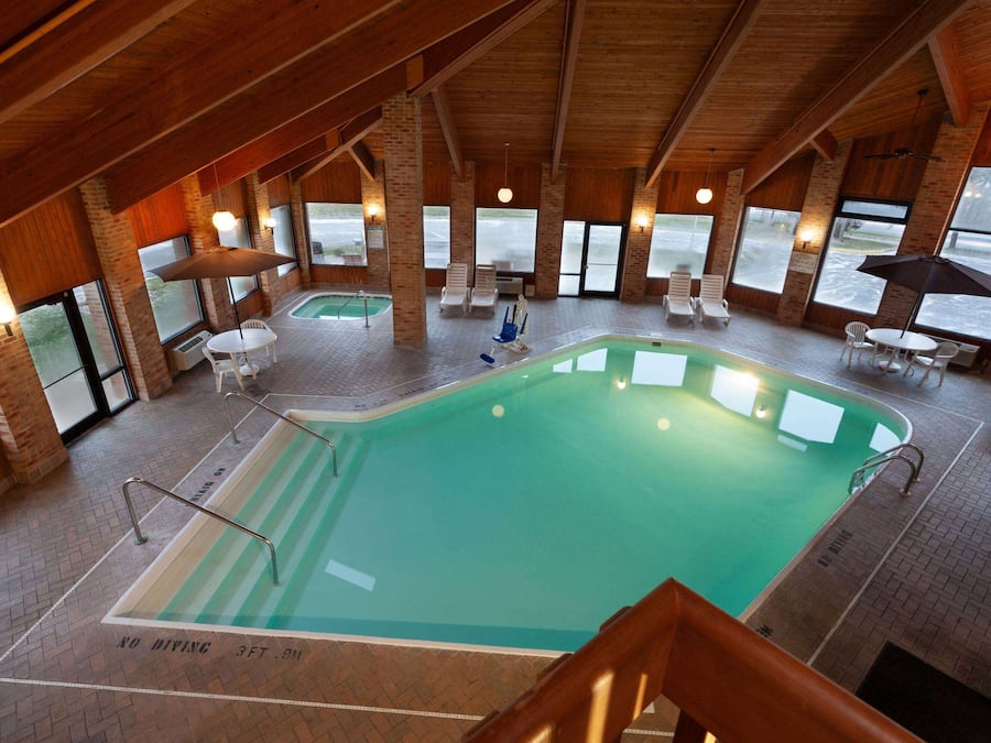 Indoor pool, open 9 AM to 9:00 PM, pool umbrellas, pool loungers