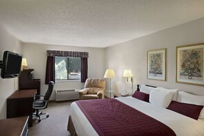 Desk, laptop workspace, blackout drapes, iron/ironing board