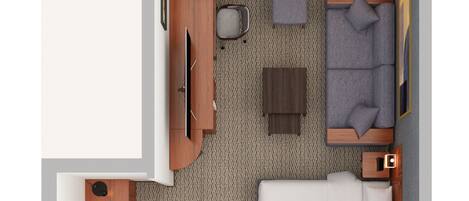 Une chambre d’hôtel avec deux lits, une salle de bain séparée, un coin salon avec un canapé et une table basse, et un petit balcon.