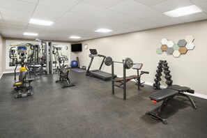 A gym with various exercise equipment, including treadmills, weight machines, and free weights. - Best Western Swan Castle Inn (Cochrane)