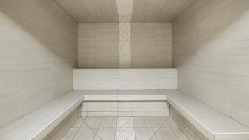 A modern, empty room with a bench and tiled walls.