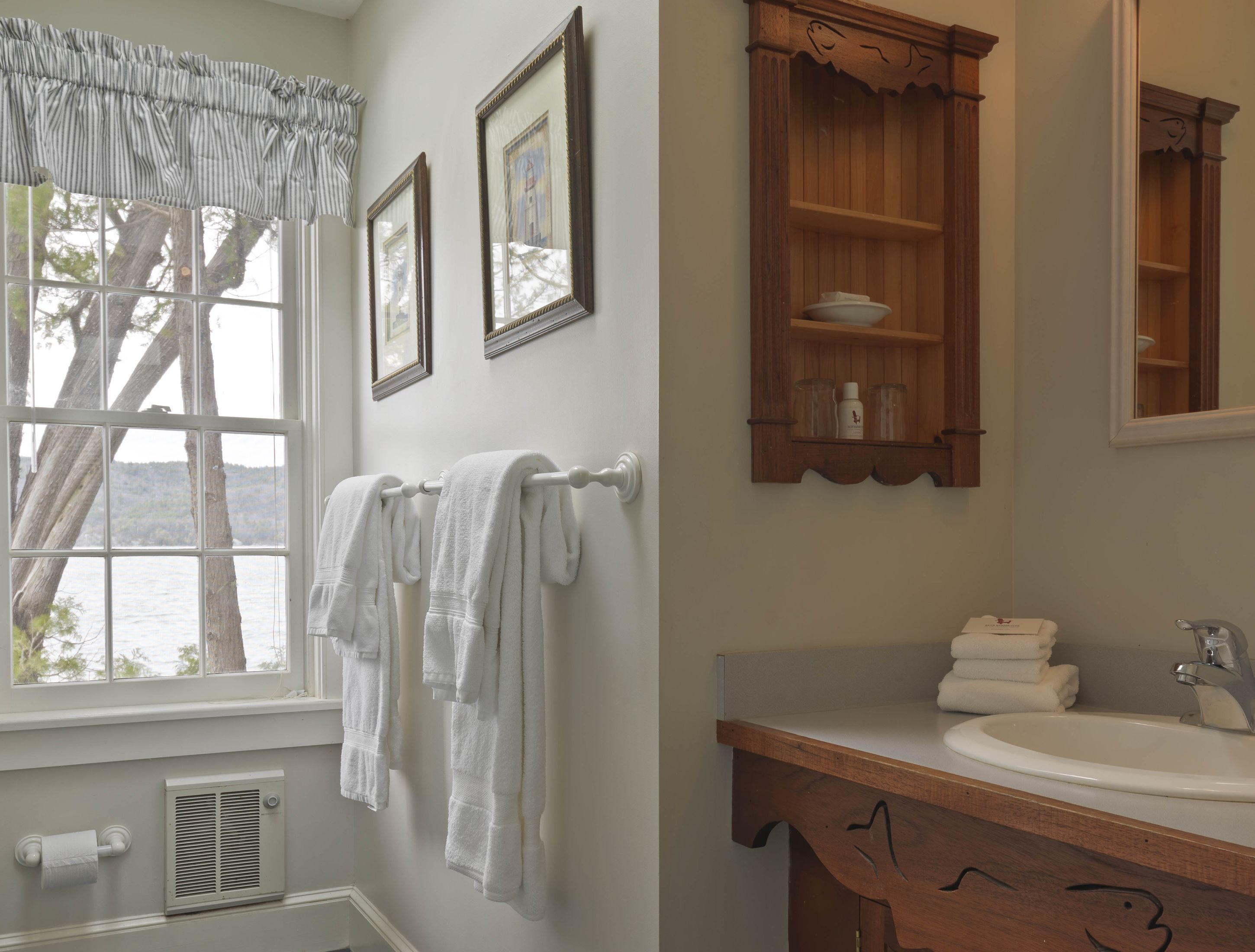 A bathroom with a window, towels, a sink, and a wooden cabinet.