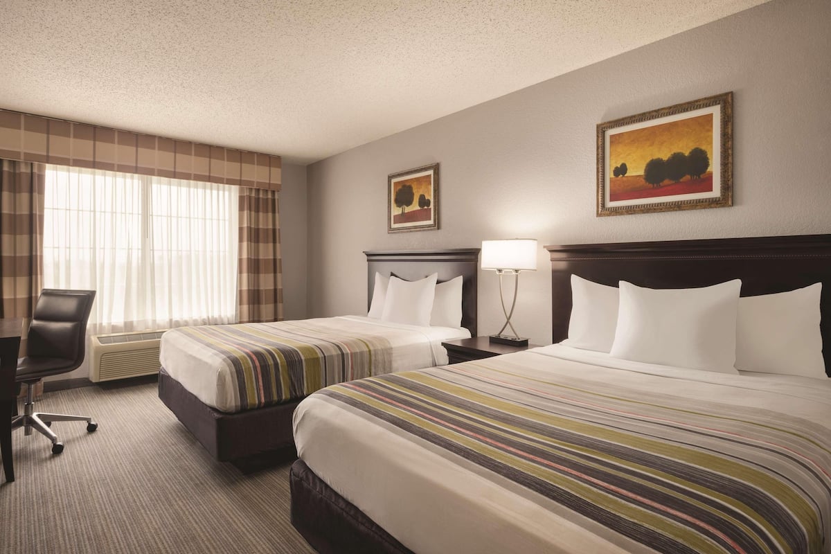 Hypo-allergenic bedding available, down comforters, desk