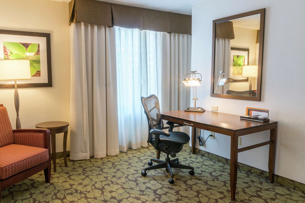 Desk, laptop workspace, blackout curtains, iron/ironing board