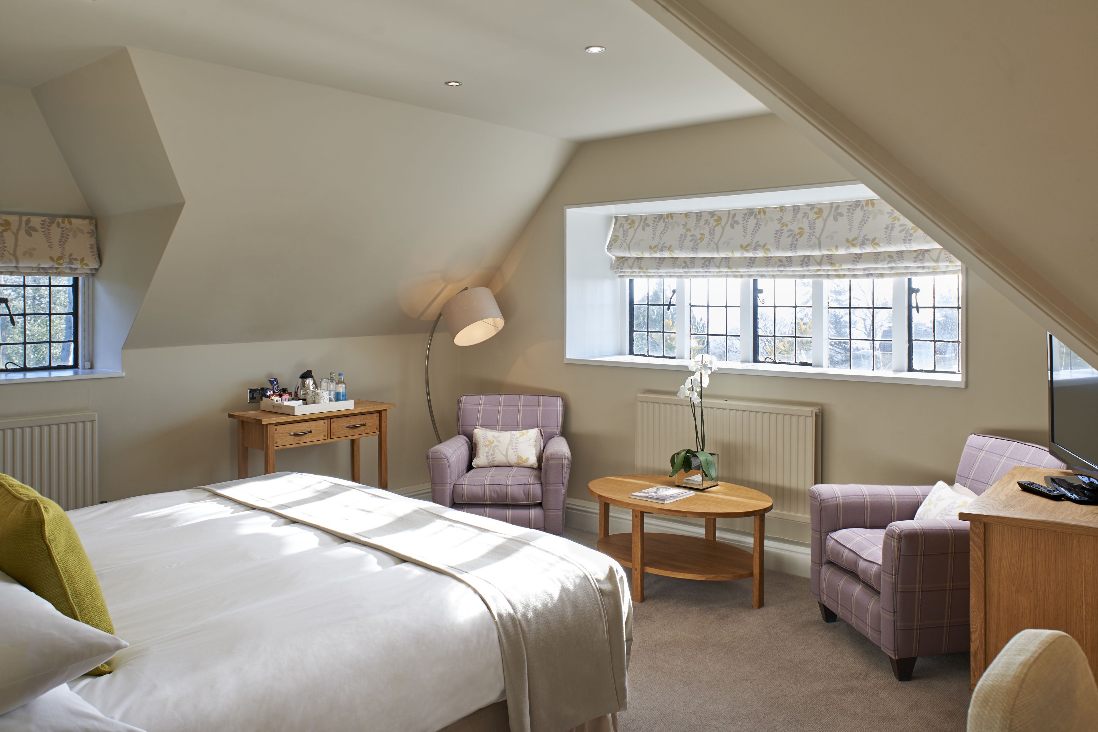 deluxe room | in-room safe, desk, iron/ironing board, cots/infant beds