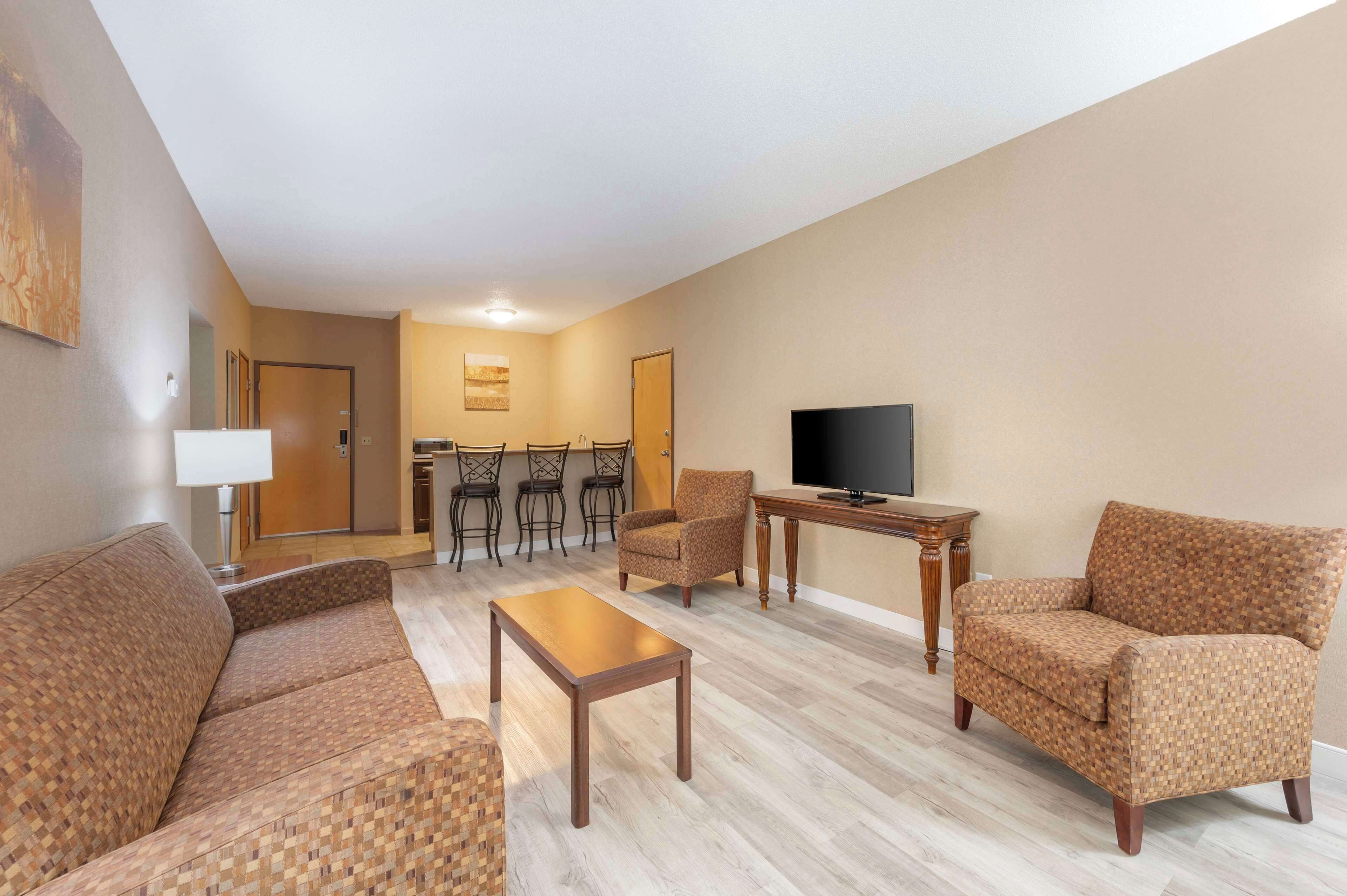 suite, 1 king bed, non smoking, balcony (separate living room) | desk, laptop workspace, iron/ironing board, wifi