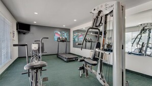 A gym with cardio equipment, a treadmill, and weight machines. - Quality Inn Laurinburg (Laurinburg)