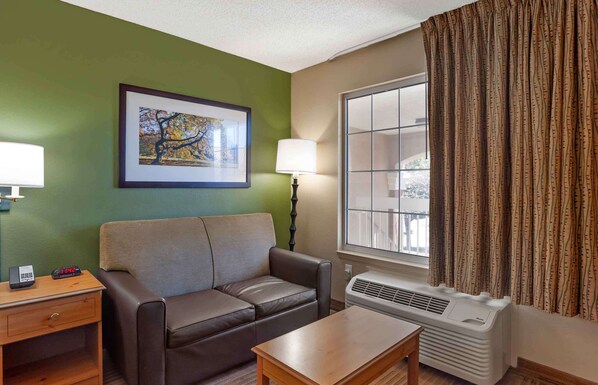 Premium bedding, desk, laptop workspace, iron/ironing board