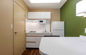 Premium bedding, desk, laptop workspace, iron/ironing board