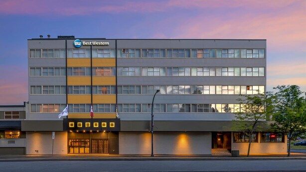 A modern hotel building with a "Best Western" sign, multiple floors, and a well-lit entrance. - Best Western Terrace Inn (Terrace)