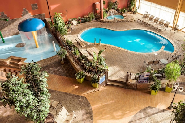 Indoor pool, open 9:00 AM to 9:00 PM, pool loungers