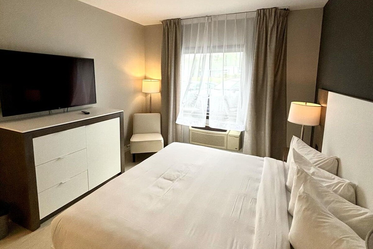Desk, blackout drapes, iron/ironing board, cribs (surcharge)