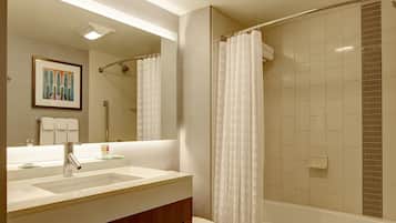 Combined shower/bathtub, designer toiletries, hair dryer, towels