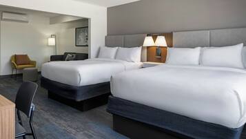 Premium bedding, desk, laptop workspace, blackout drapes