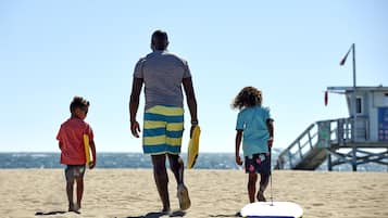 Guests can enjoy a safe and scenic beach experience with a lifeguard tower nearby.
