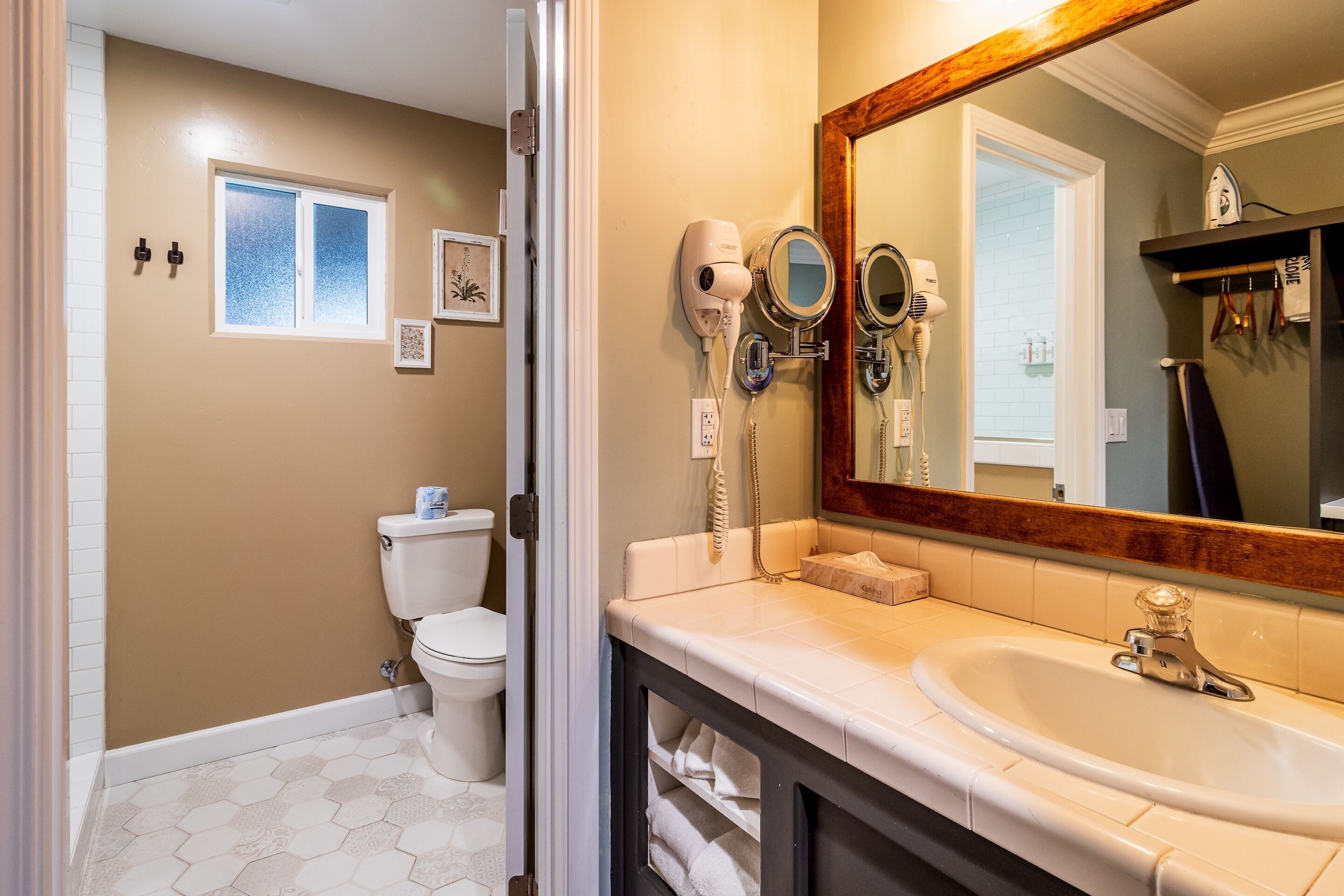 deluxe room, 2 queen beds | bathroom | eco-friendly toiletries, hair dryer, towels