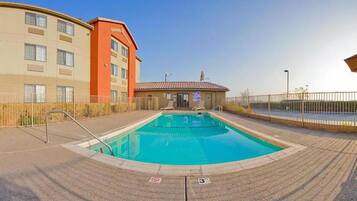 Outdoor pool, open 10:00 AM to 10:00 PM, pool loungers