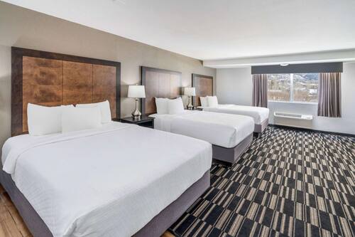Deluxe Room, Multiple Beds, Non Smoking | Pillow-top beds, individually furnished, blackout curtains