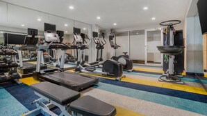 A gym with treadmills, elliptical machines, and weight machines. - MainStay Suites (Tallahassee)