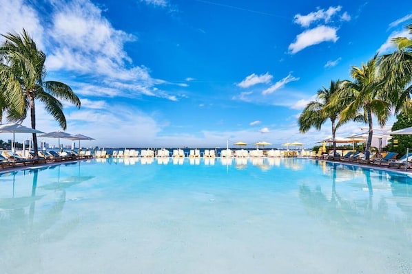 Outdoor pool, pool umbrellas, sun loungers