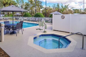 Outdoor pool, open 6:00 AM to 10:00 PM, pool umbrellas