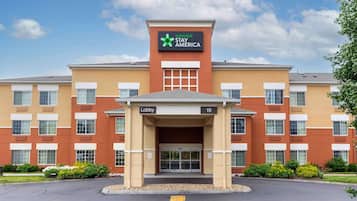 Welcome to Extended Stay America, where a central entrance leads to the lobby and rooms.