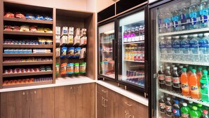 A refrigerated beverage display with various drinks and snacks. - Residence Inn By Marriott Minneapolis Downtown (Minneapolis)